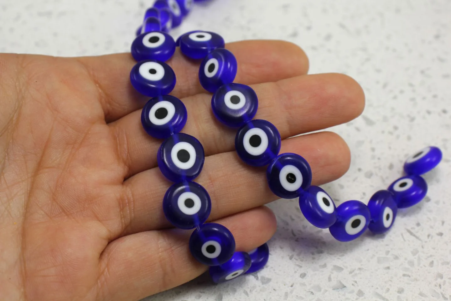 flat-round-evil-eye-beads-strand.