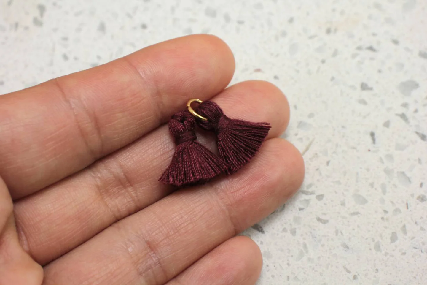 mini-cotton-tassel-with-ring-attached.