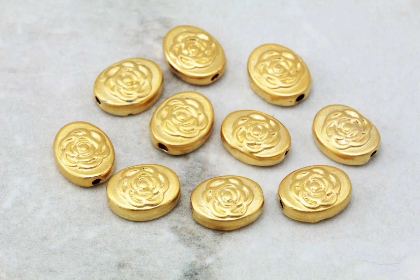 gold-plated-oval-rose-patterned-charms.