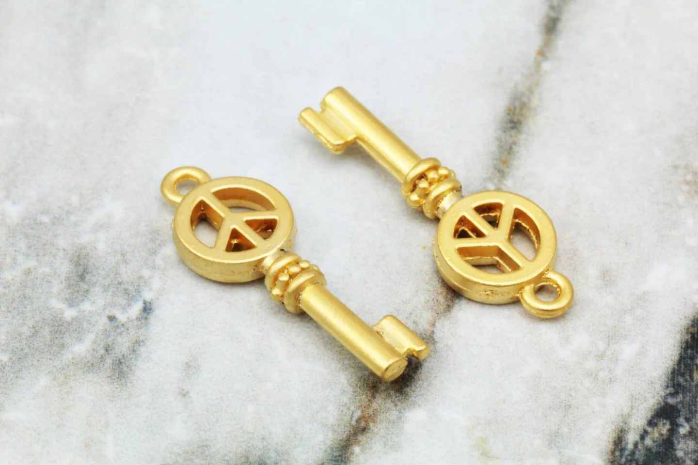 gold-metal-peace-sign-key-pendant.