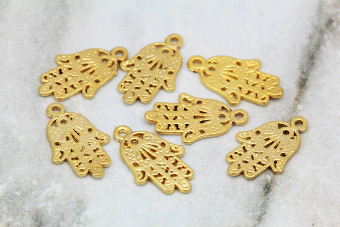 gold-plated-tiny-hamsa-hand-pendants.