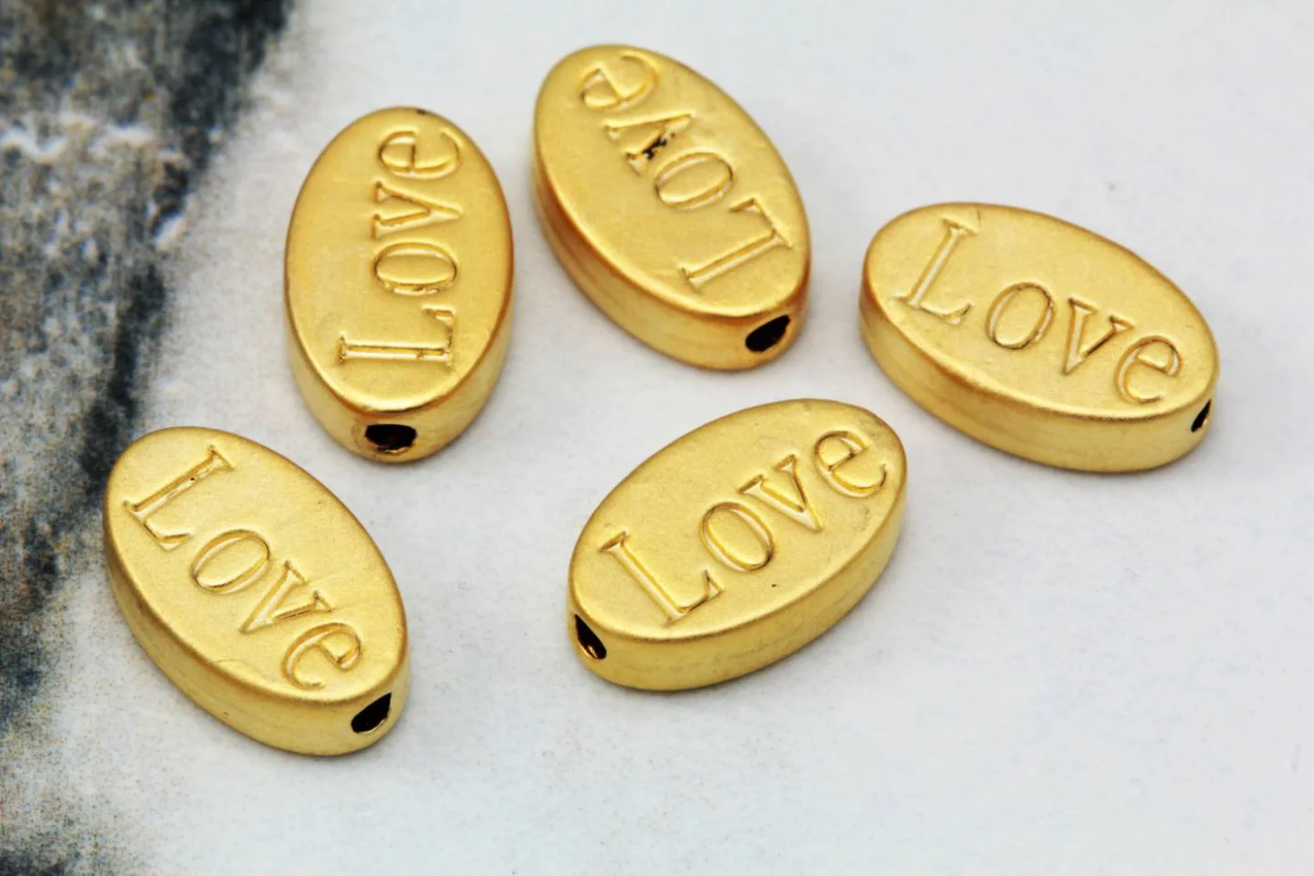gold-plated-metal-flat-oval-love-charm.