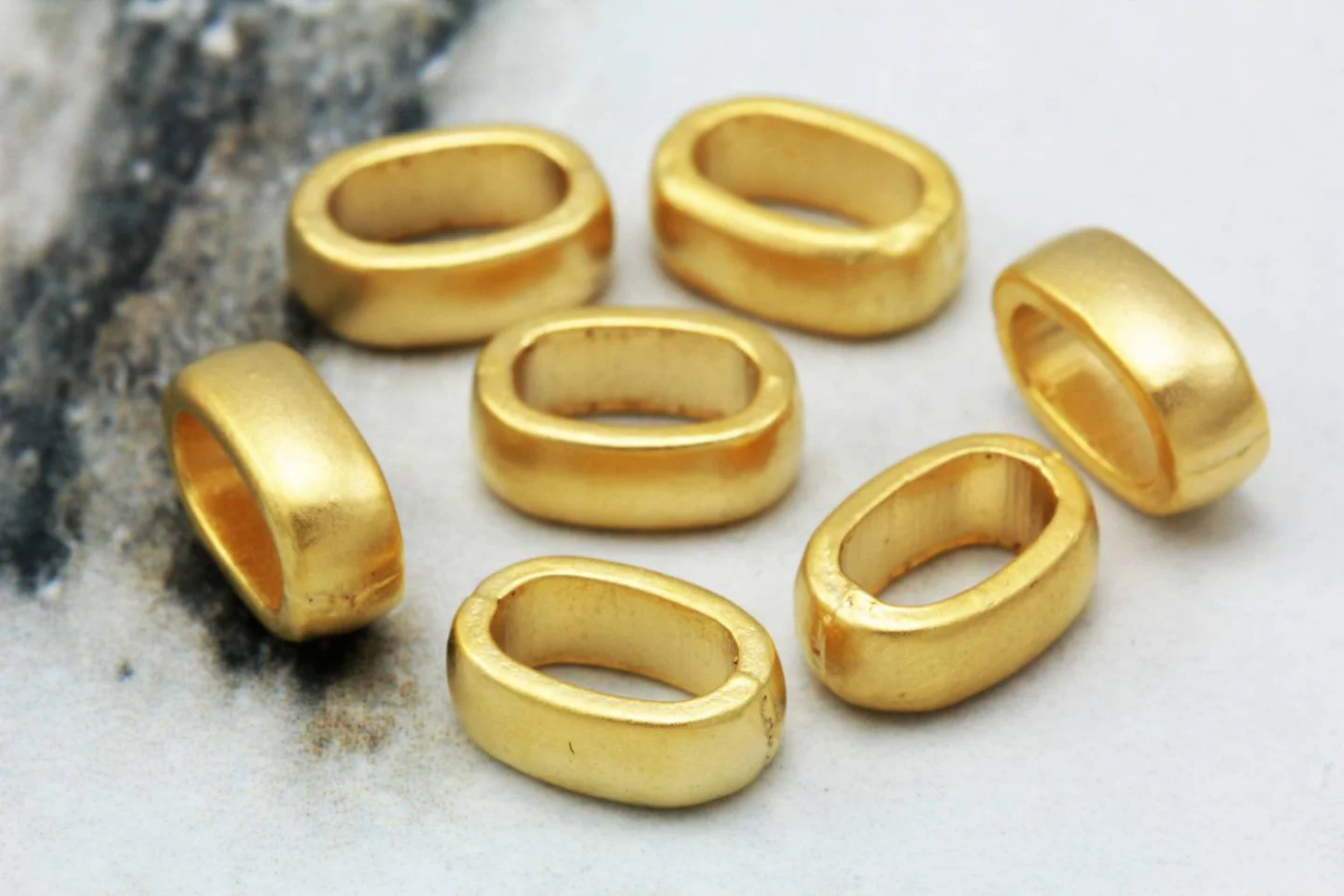 gold-plated-metal-oval-spacer-beads.