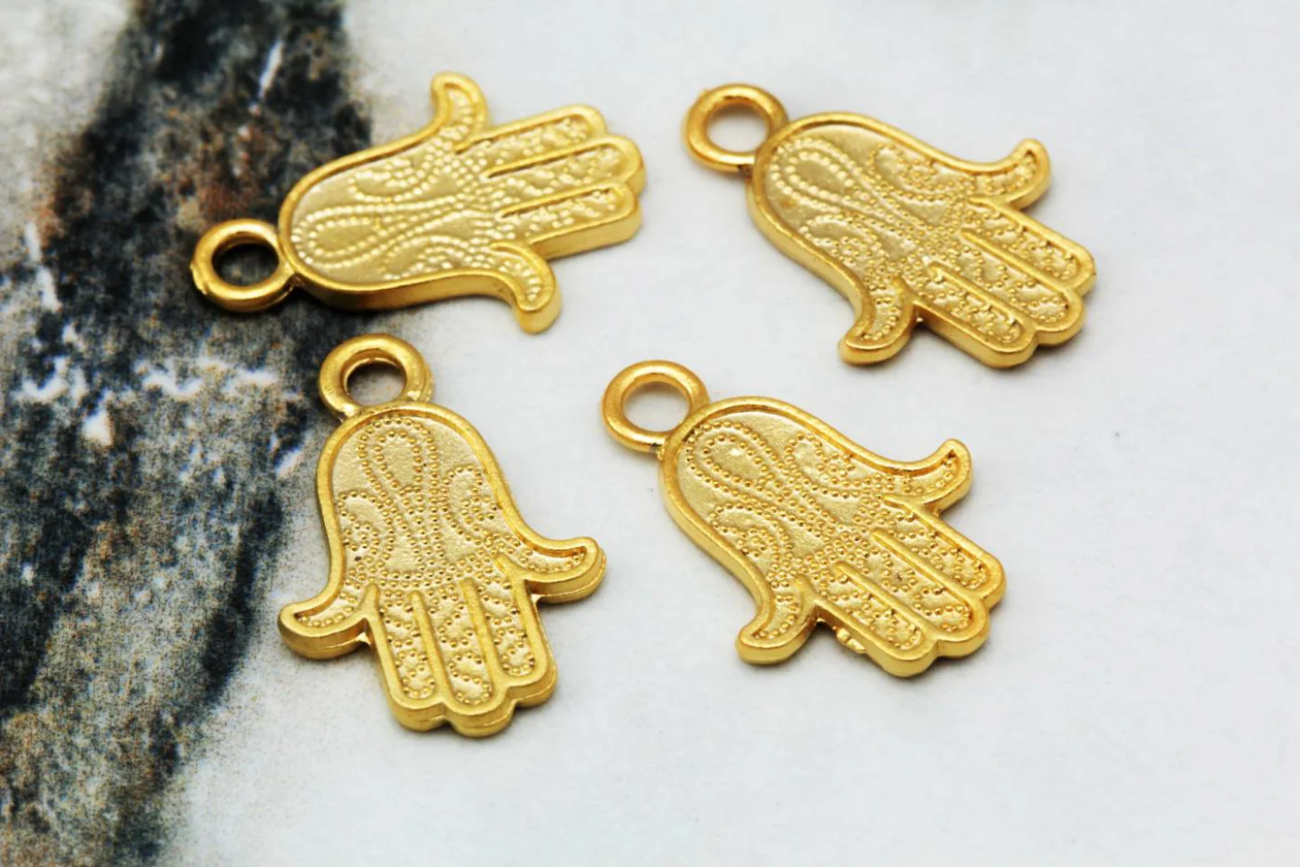 gold-plated-metal-hamsa-pendants.